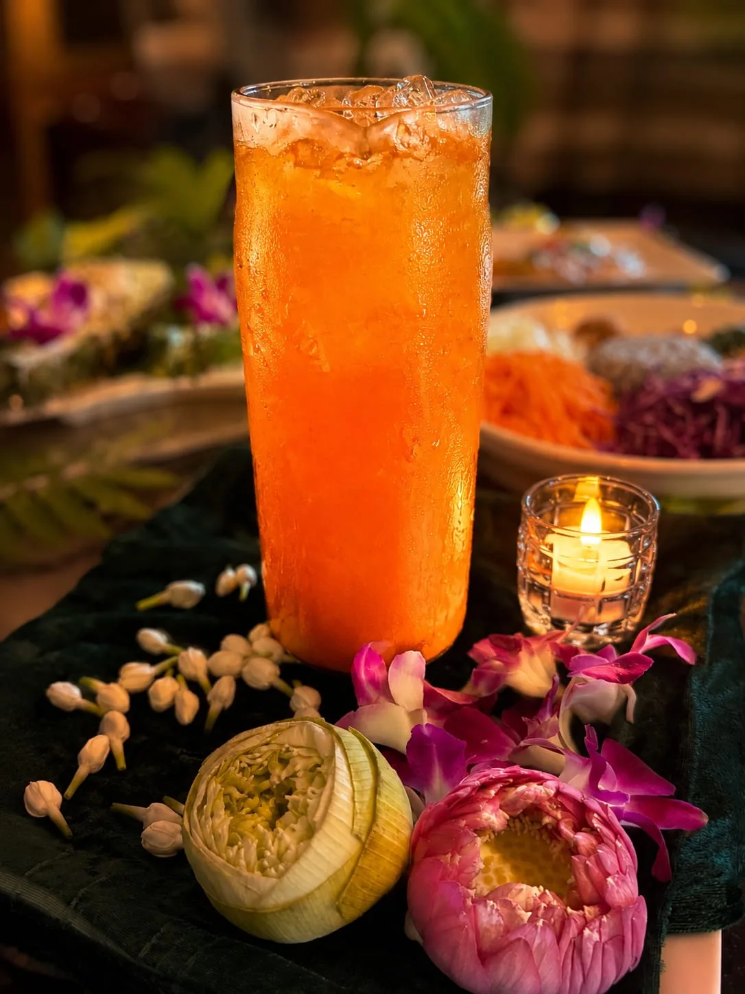 Cold-Pressed Orange Elixir — Iced, with Lotus Flowers