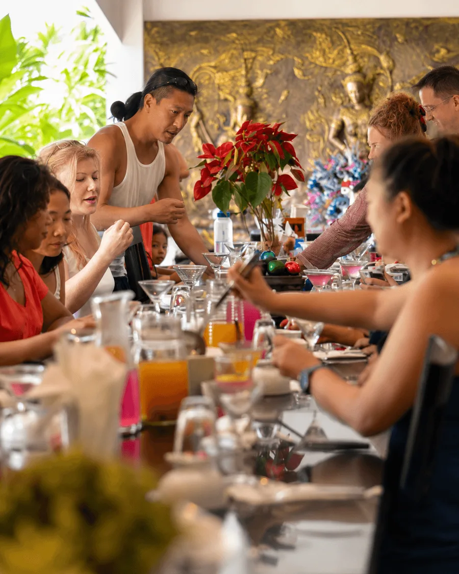 Guests gathered around the long table at Phuket Cleanse