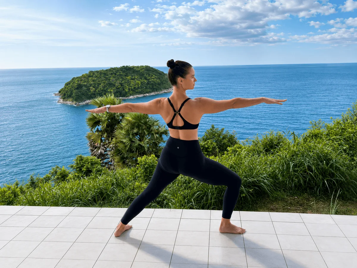 Warrior pose yoga overlooking the Andaman Sea — Phuket Cleanse