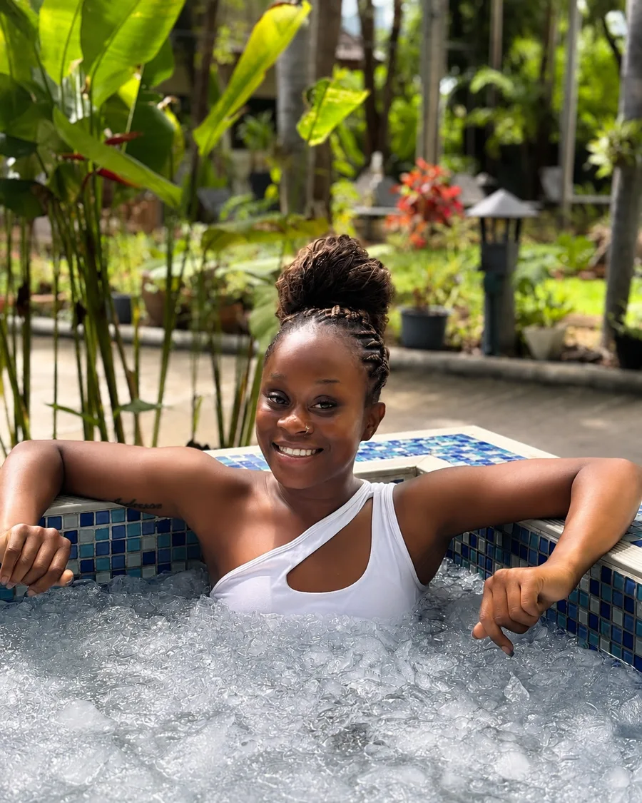 Guest smiling in the ice bath at Phuket Cleanse