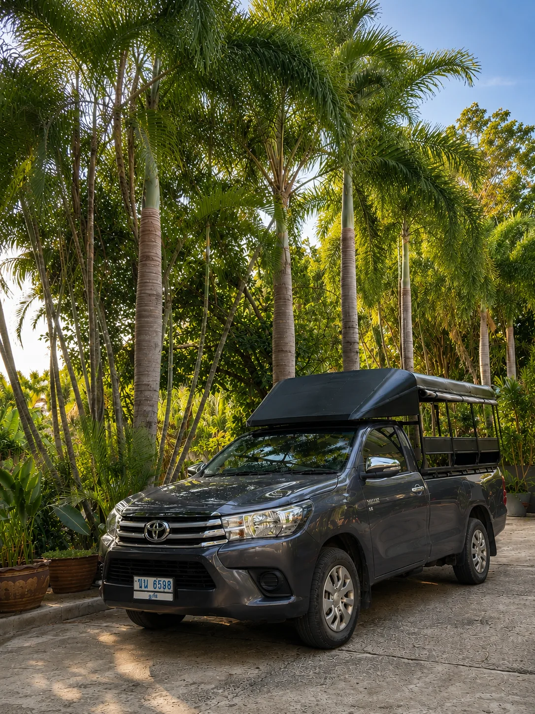 Phuket Cleanse pickup truck in the tropical grounds