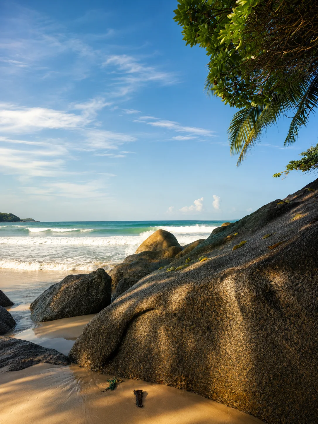 Rocky beach with turquoise Andaman Sea in Rawai