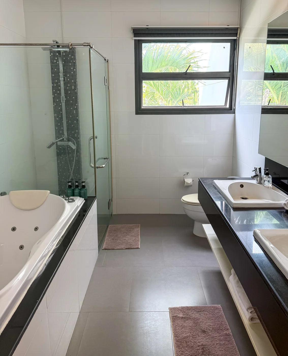 Supreme-Plus room en-suite bathroom with jacuzzi bath and separate shower at Phuket Cleanse