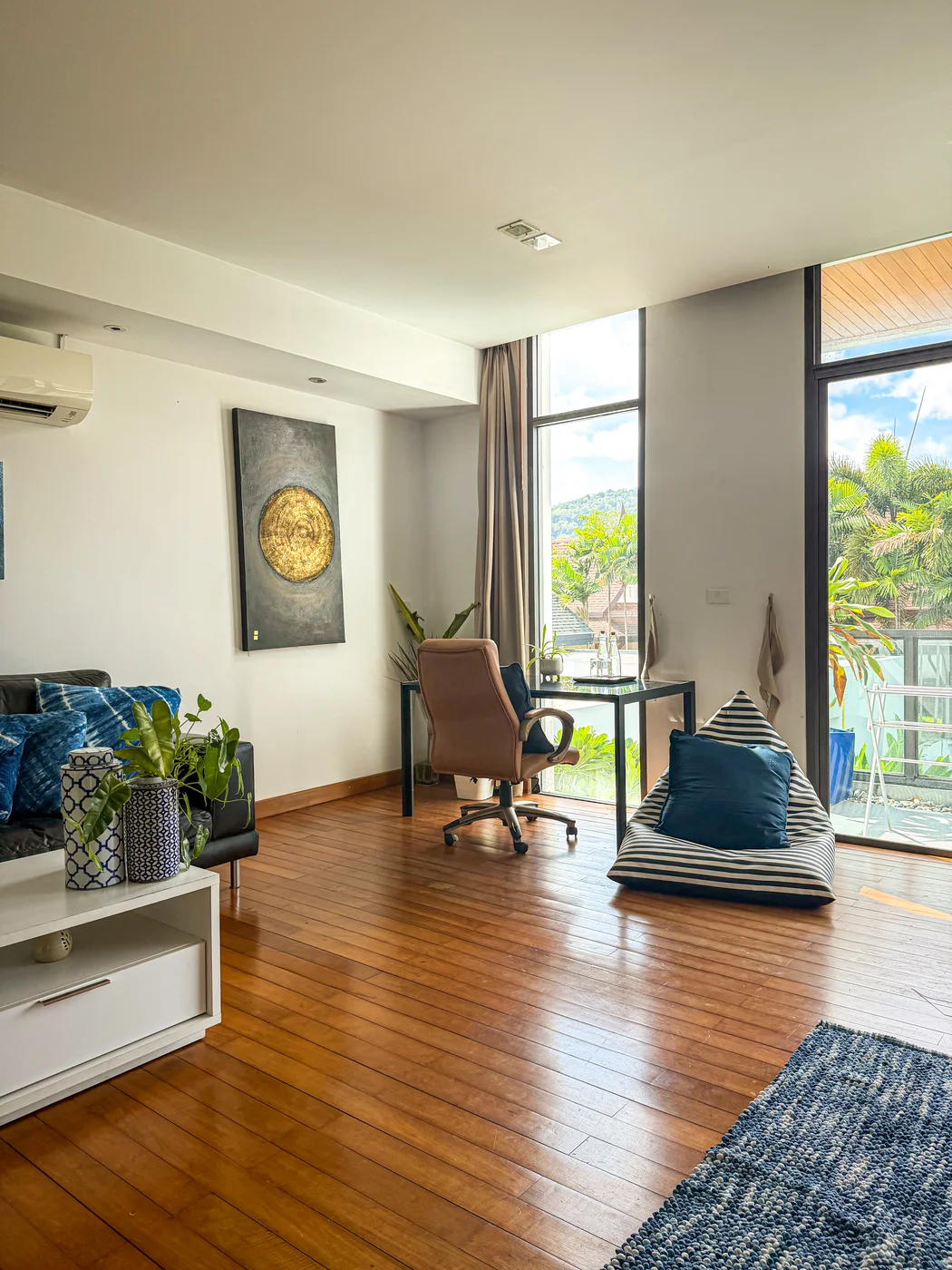 Supreme-Plus room living area with floor-to-ceiling windows and garden view at Phuket Cleanse